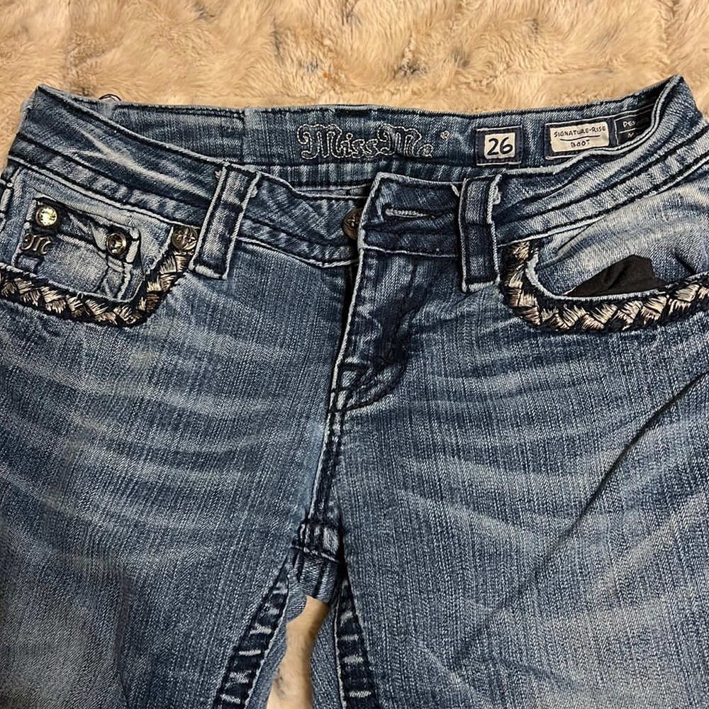Miss Me jeans. Some wear but still in good shape.